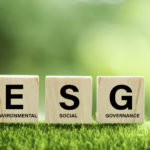 words ESG on a wood block and Future environmental conservation and sustainable ESG modernization development by using the technology of renewable resources to reduce pollution and carbon emission.