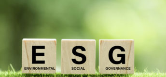words ESG on a wood block and Future environmental conservation and sustainable ESG modernization development by using the technology of renewable resources to reduce pollution and carbon emission.
